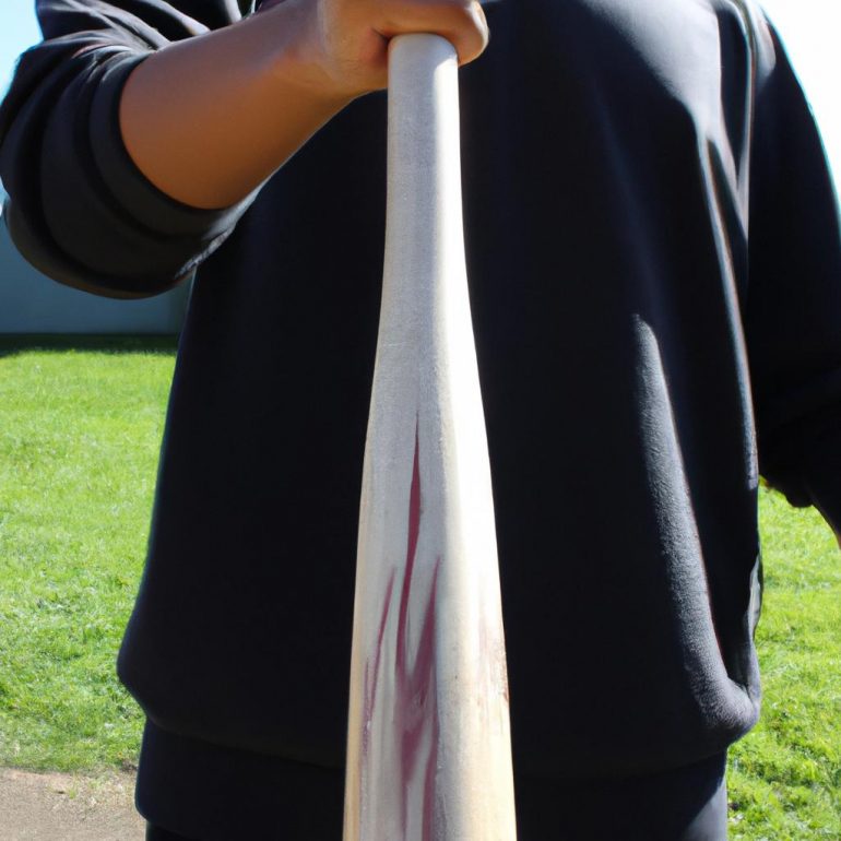 Person holding baseball bat correctly