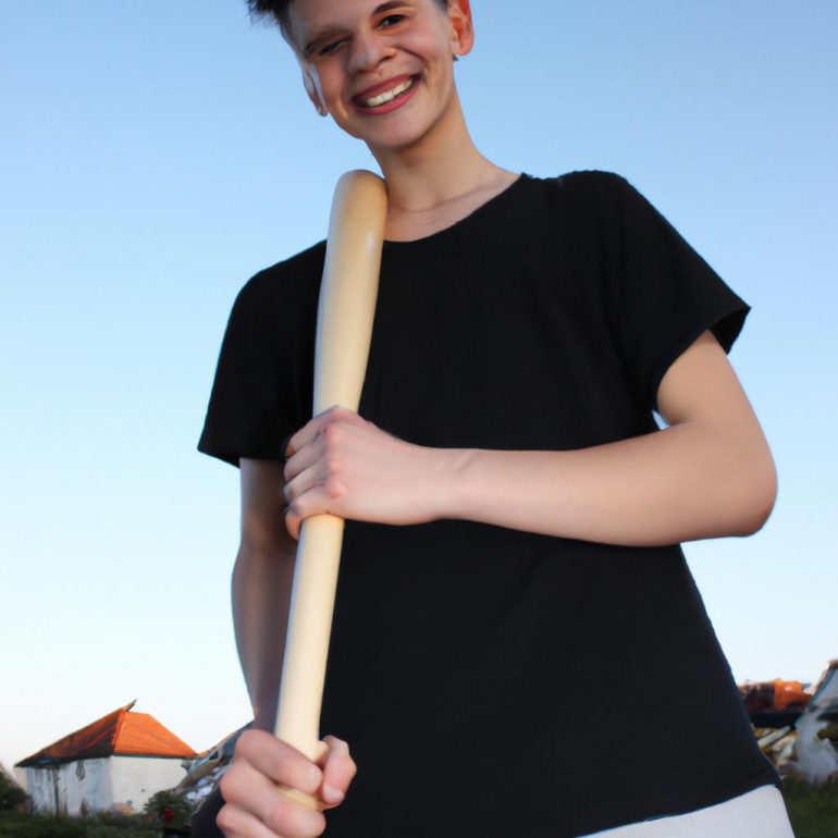 Person holding baseball bat, smiling